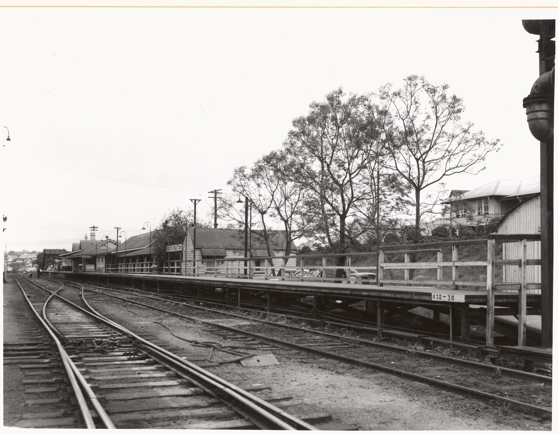 Historic black and white photograph of South Grafton Station from the opposite direction along the platform and yard tracks.