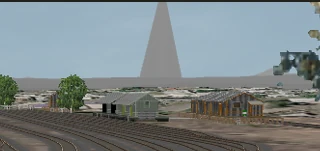 A huge accidental terrain spike visible in the distance after distant terrain was enabled in the route.